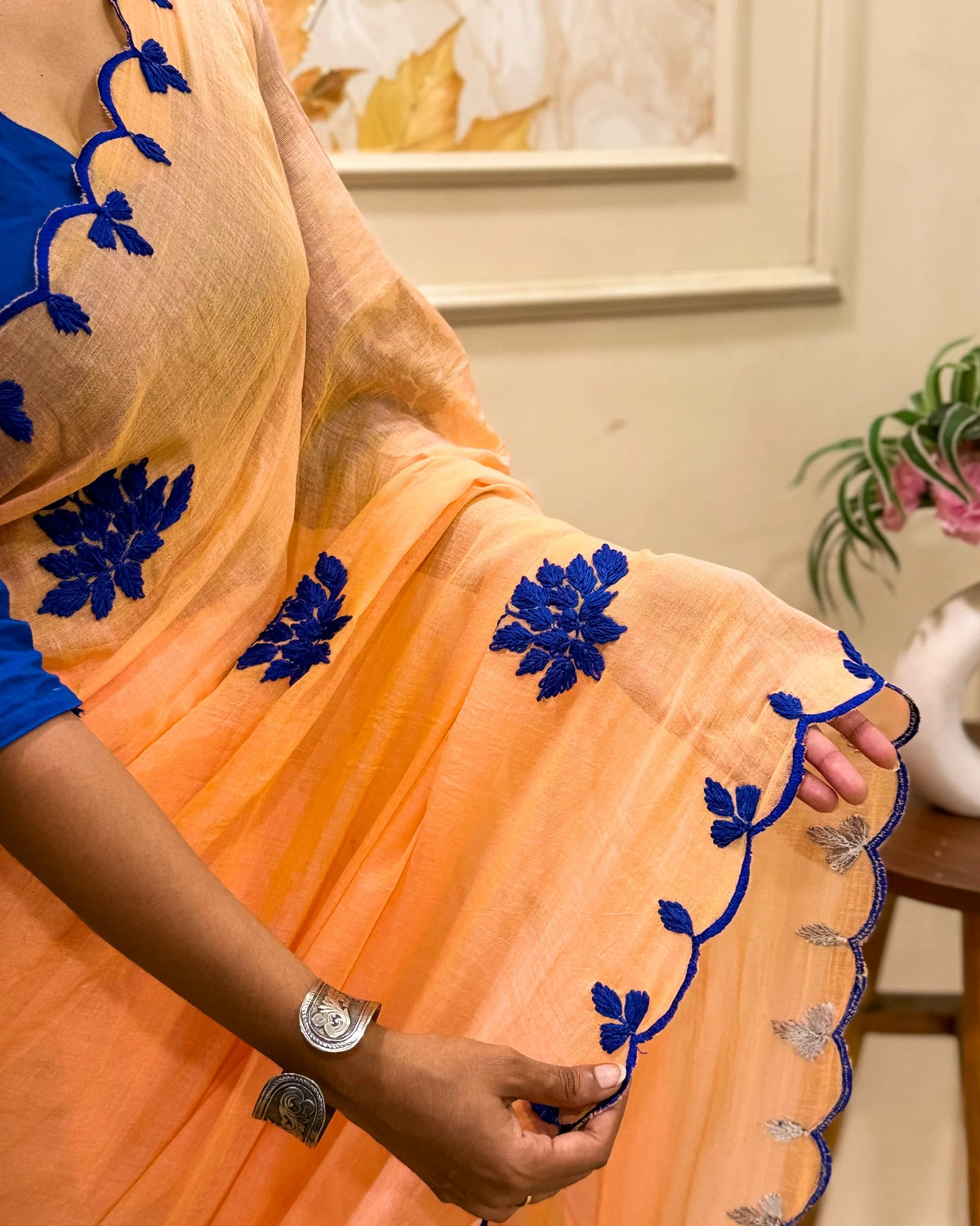 Aame - Amber Azure (Peach Hand Embroidered Mulmul Saree)