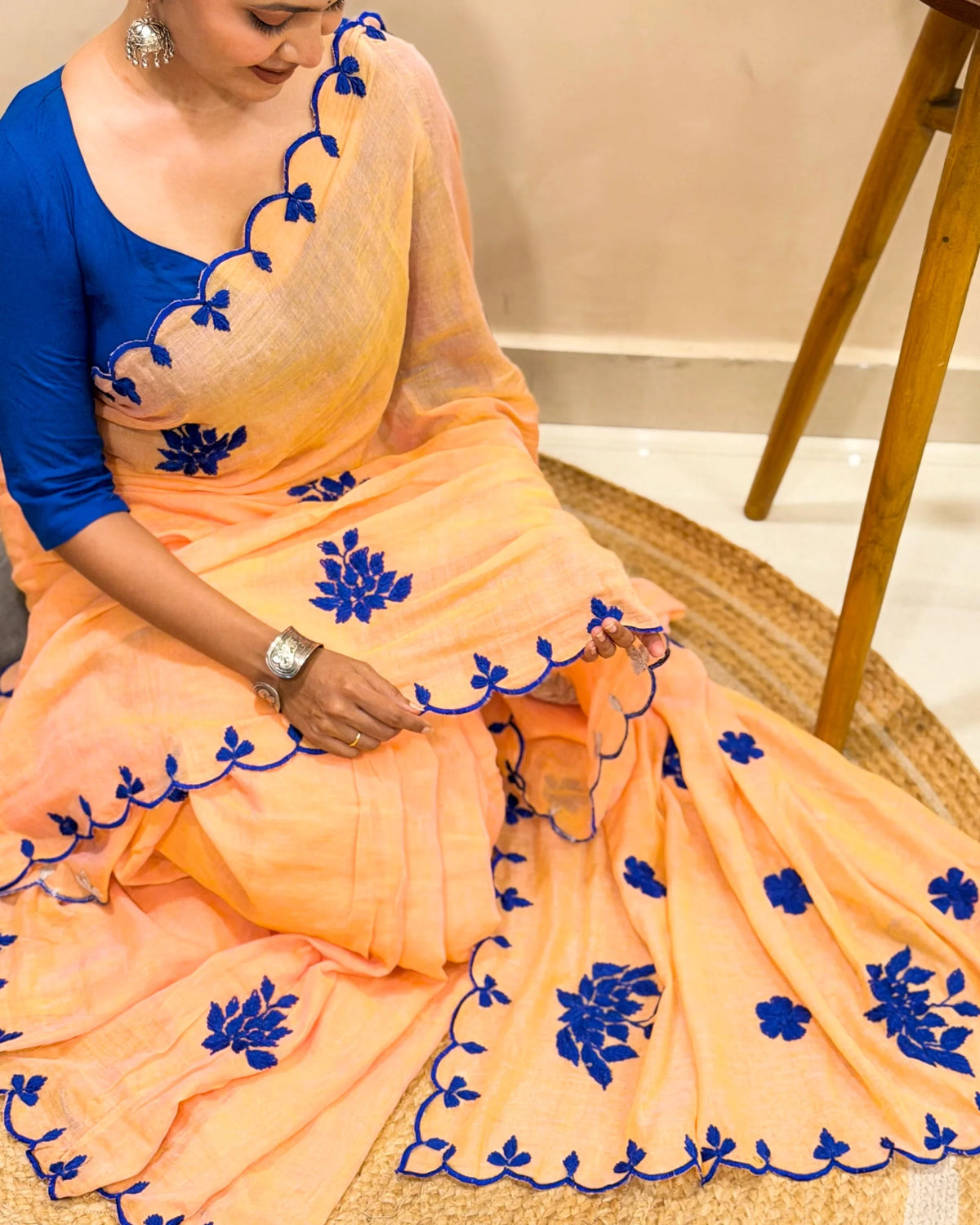 Aame - Amber Azure (Peach Hand Embroidered Mulmul Saree)