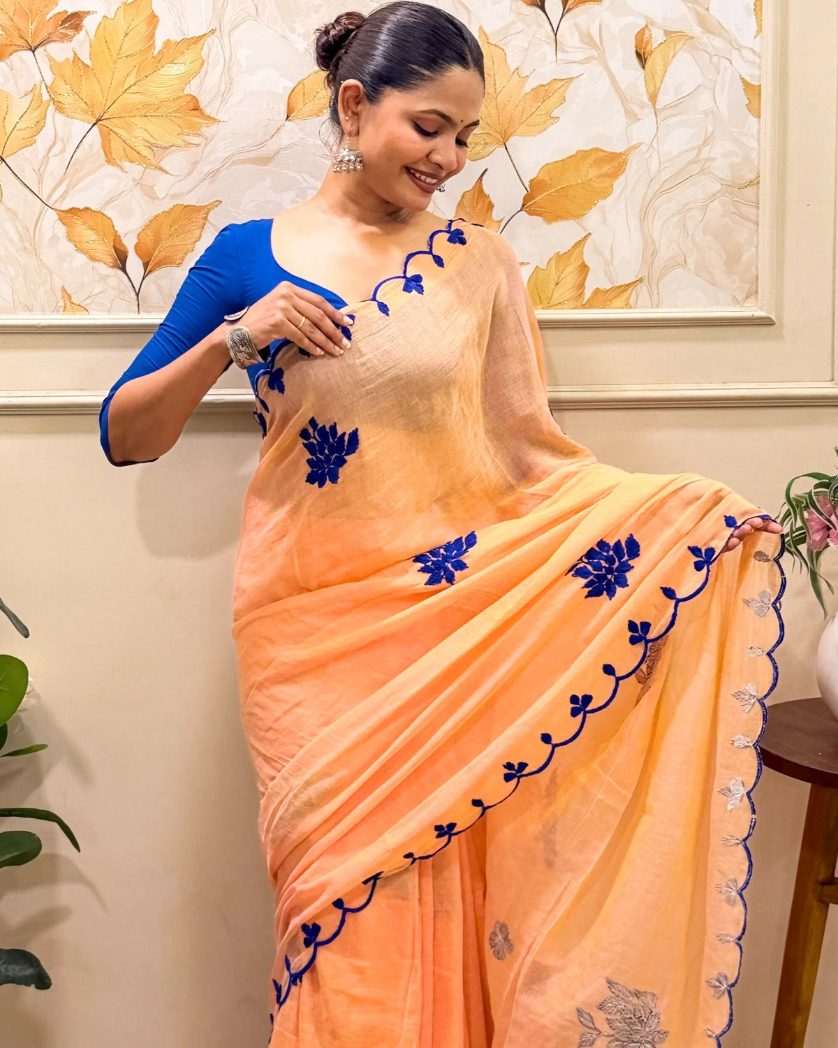 Aame - Amber Azure (Peach Hand Embroidered Mulmul Saree)
